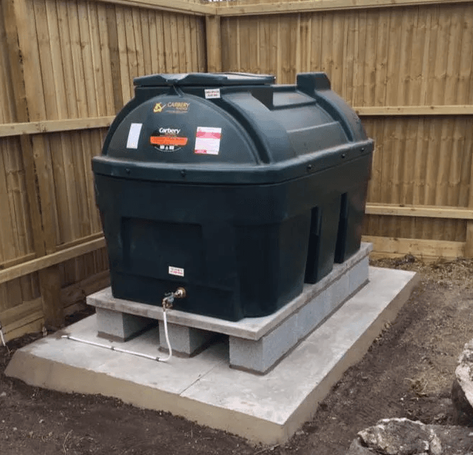New bunded oil tank on a concrete base, fitted after removing the old tank