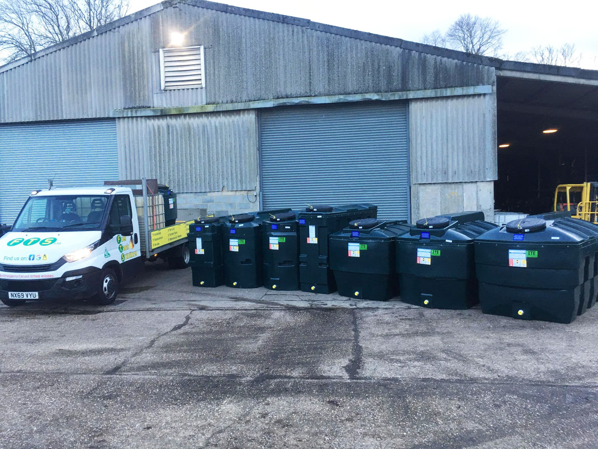 Fuel Tank Solutions van beside a row of new bunded oil tanks at the depot